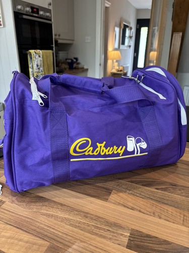 New cadbury holdall bag purple - new,