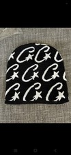Black Cortiez Beanie With White Stars Dooted Around The Whole Head Of The Beanie