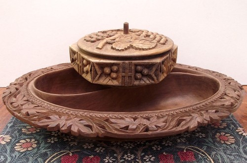 Two heavily carved nut dishes - carved,