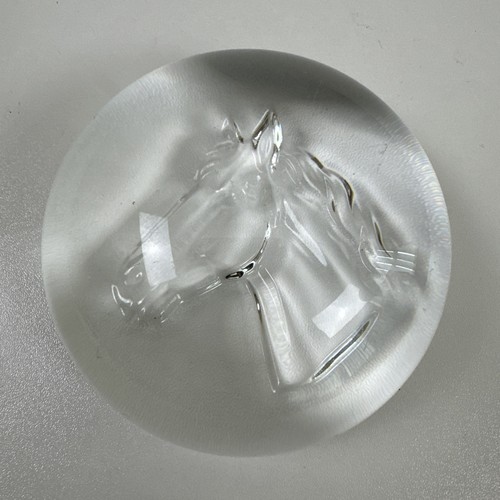 Clear glass paperweight with - , a