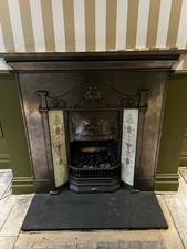 TILED CAST IRON FIREPLACE /