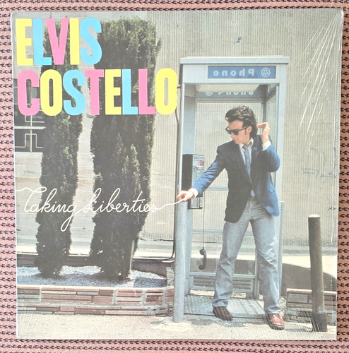 Elvis costello taking - elvis,