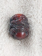 NETSUKE FOO DOG. CARVED. RESIN? LOVELY DETAILS.