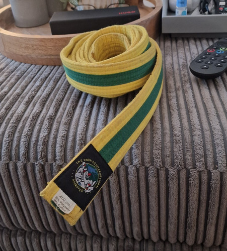 Taekwondo yellow belt with - yellow,