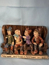 Will Young pottery figures on a pub bench Uncle Tom Cobley Widecombe Fair Devon
