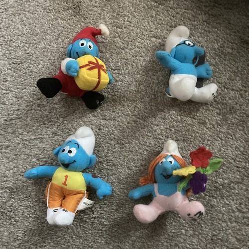 Four mcdonald toys - mcdonald's, smurfs