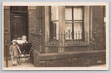 RPPC Two Girls with Pram Outside Terraced House Edwardian Children Kodak c1910