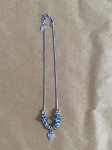 Next silver charm - ‘next’,