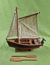 Vintage Model Wooden Sail Boat Fishing Boat with two oars and a moving wedge.