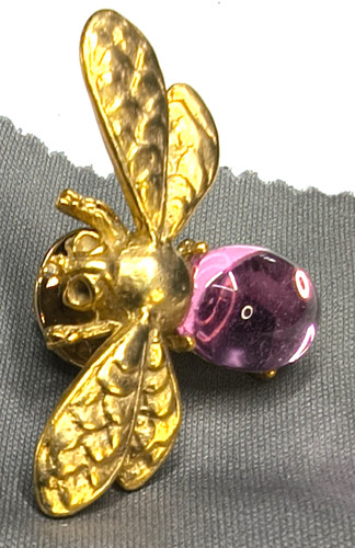 Gold tone bee - tone, flying