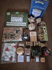 Huzzle cast puzzle bundle and Assorted Brain Teaser Puzzles Metal And Wood
