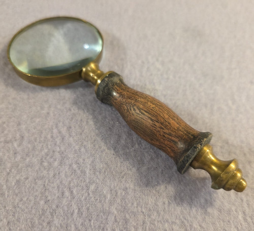 Handheld magnifying glass in - magnifying, 2