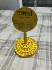 Clipper lighter display stand. Yellow spinning shop display
