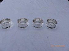 4 SILVER PLATE NAPKIN RINGS