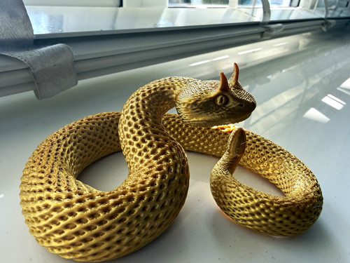 Gold metallic snake figurine - gold,