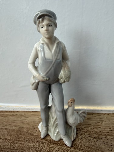 Porcelain boy with cockerel - boy,