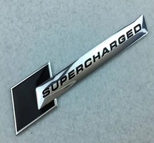 2x Supercharged Audi Badges
