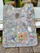 An Old And Used Artist Palette. Covered In Paint Both Sides. 39 cm Long.