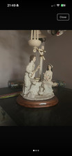 a belcari figurine man and