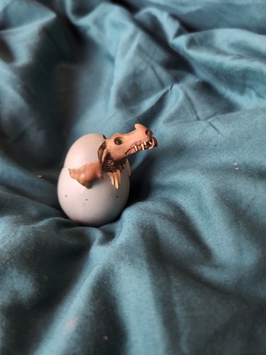Dinosaur hatching from egg - hatching,