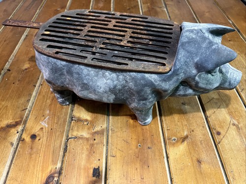 Cracker barrel cast - iron, pig