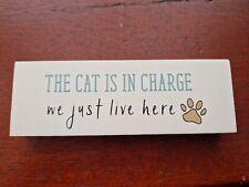 THE CAT IS IN CHARGE WE JUST