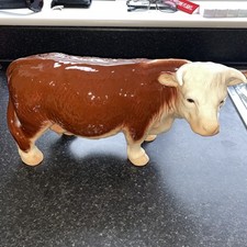 Large red bull and Calf. Used in The Red Cow pub in Ashen Essex Uk Greene King