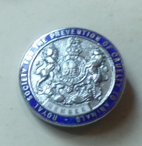 White metal and enamel rspca - and,