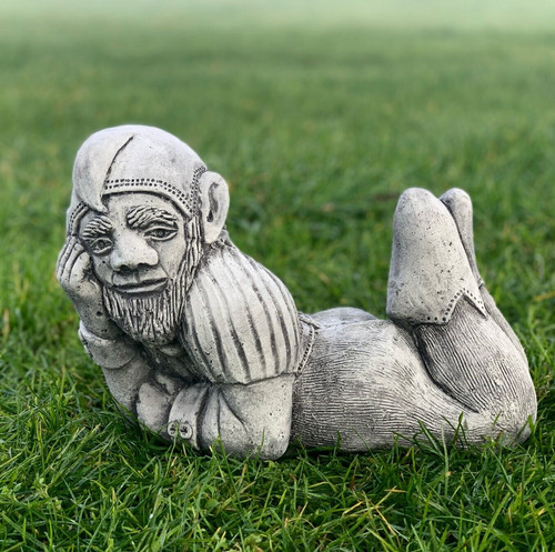 Funny lying gnome statue