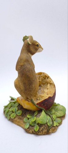 Figurine mouse feeding on - figurine,
