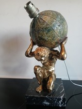 Very unusual table lamp featuring Sampson and a globe.