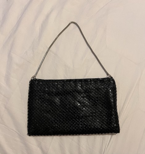 Black handbag features - , a