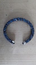 SWAROVSKI,  STAMPED,   BRACELET/ BANGLE.  DARK - BLUE  CRYSTALS.