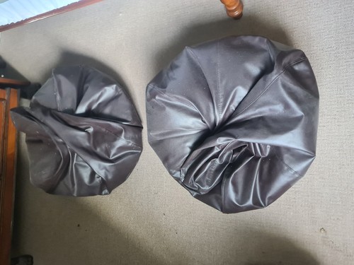 Two brown leather bean bags