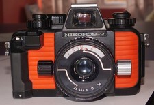 Nikonos V camera  flash gun and fisheye lens.