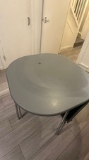 Grey Coloured Round Dining Set with Steel Legs Includes Table and 3 Chairs.