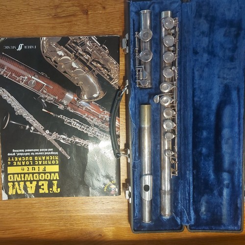 Gemeinhardt flute and book - and,