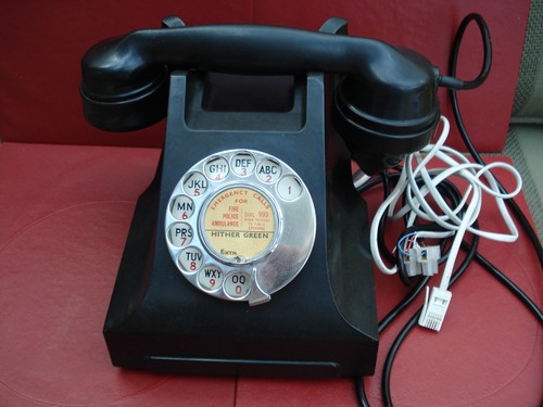 Black bakelite telephone - black,