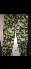 Golddigga Green floral trousers. Slim leg. Small Size 16. would fit 14.