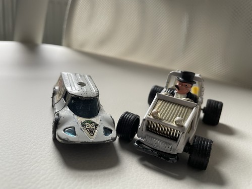 Penguin mobile and joker van - and,