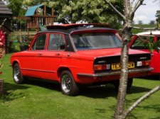 PHOTO  A 1981 TRIUMPH DOLOMITE SPRINT RECEIVING ATTENTION TO ITS ENGINE PART OF