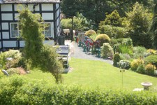 Photo 6x4 Colourful Implements in garden Welshpool/Y Trallwng  c2009
