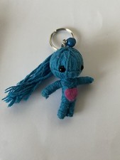 Blue Voodoo Doll With A Pink