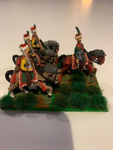 Four miniature soldiers - four,