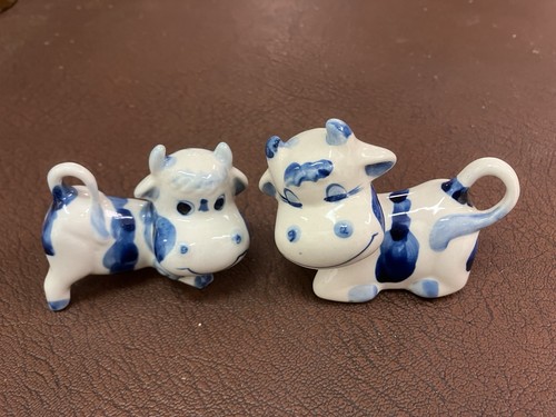 Small ceramic pottery cows - 2,