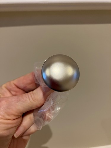 Twelve nickel coloured knobs - coloured,