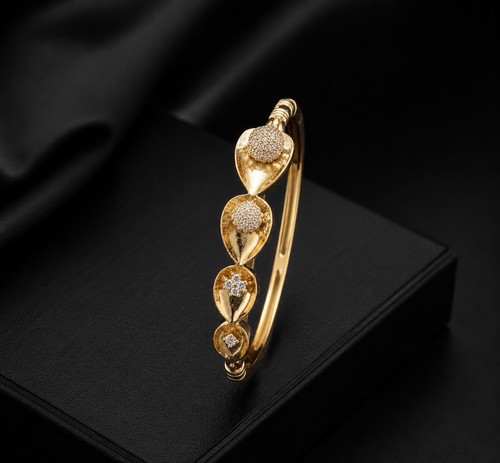 Gold tone leaf bangle bracelet - tone,