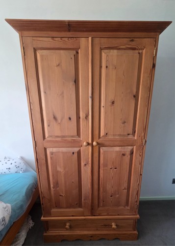 Wooden wardrobe with drawer