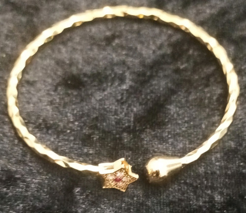 Gold tone metal bangle - tone,