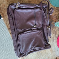 Brown leather suit carrier